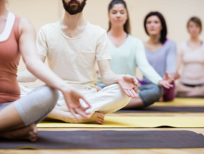 Group people sitting lotus position